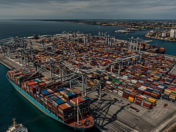 Cargo ship at container port terminal for international sea freight